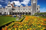 1906;architecture;building;buildings;city-gardens;clock;clock-tower;clock-towers;color;colorful;colors;colour;colourful;colours;council-gardens;Dunedin;Dunedin-Railway-Station;Flemish-Renaissance-style;floral;flower;flower-bed;flower-beds;flower-garden;flower-gardens;flowers;garden;gardens;George-A-Troup;Gingerbread-George;heritage;Historic;historic-building;historic-buildings;historical;historical-building;historical-buildings;history;New-Zealand;old;Otago;rail-station;rail-stations;railway;railway-station;railway-stations;railways;South-Island;tradition;traditional;train-station;train-stations;yellow