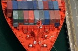ship;container;containers;orange;red;row;rows;stack;stacks;stacked;stacking;rope;ropes;dock;docked;docking