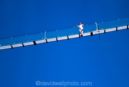 Buller-Gorge-Swingbridge;Murchison;buller-gorge;gorges;buller-river;rivers;person;people;swing-bridge;swing_bridge;swingbridge;wire-bridge;suspension-bridge;swing-bridges;swing_bridges;swingbridges;wire-bridges;suspension-bridges;bridge;bridges;footbridge;footbridges;high;tramp;tramper;tramping;trampers;walk;walker;walkers;walking;height;danger;dangerous;exciting;excite;adrenaline;adventure;adventurous;outdoor;outdoors