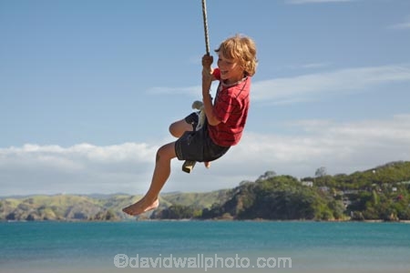 8-year-old;8-years-old;9-year-old;9-years-old;boy;boys;child;children;coast;coastal;coastline;coastlines;coasts;eight-years-old;eigth-year-old;foreshore;fun;happy;joy;kid;kids;kiwi-icon;kiwi-icons;kiwiana;little-boy;little-boys;N.I.;N.Z.;New-Zealand;NI;nine-year-old;nine-years-old;North-Is;North-Is.;North-Island;Northland;NZ;Oakura;Oakura-Bay;outdoor;outside;people;person;play;playing;rope-swing;rope-swings;shore;shoreline;shorelines;shores;sky;summer;summertime;swing;swinging;swings;tidal;tide;water;Whangaruru-Bay;young-boy;young-boys