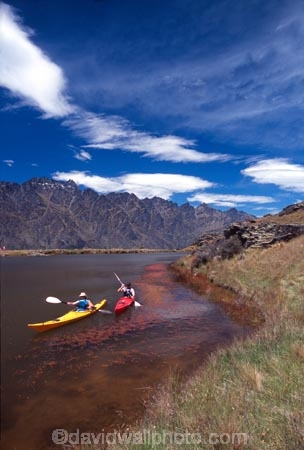 kayak;kayaks;kayaker;kayakers;water;paddle;paddler;paddlers;paddling;paradise;beautiful;lakes;lake;adventure;adventure-tourism;recreation;outdoors;outdoor;outside;relax;relaxing;yellow;boat;pristine;summer;holiday;holidays;vacation;vacations;deer-park-heights;deer-park;the-remarkables;remarkables;queenstown;south-island;new-zealand;tarn;tarns;pond;ponds;sea-kayak;sea-kayaks;red;two;pair;mountain;mountains