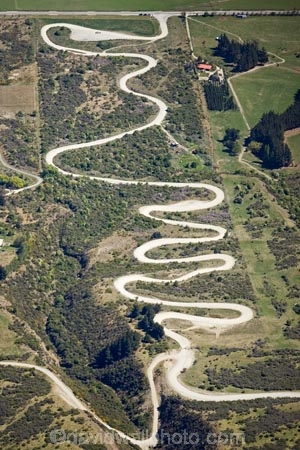 aerial;aerial-photo;aerial-photography;aerial-photos;aerial-view;aerial-views;aerials;bend;bends;corner;corners;countryside;curve;curves;dusty;gravel-road;gravel-roads;metal-road;metal-roads;metalled-road;metalled-roads;N.Z.;New-Zealand;NZ;Otago;Queenstown;Remarkables;Remarkables-Ski-Field;road;roads;rural;S.I.;sharp-bend;sharp-bends;SI;South-Is.;South-Island;Southern-Lakes;Southern-Lakes-District;Southern-Lakes-Region;steep;The-Remarkables;zig-zag;zig_zag;zigzag;Zigzag-Road