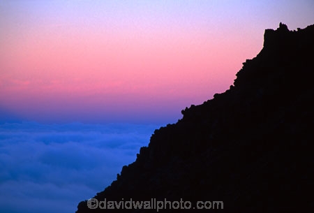 cloud;clouds;color;colors;colour;colours;darkness;figure;fog;glow;light;man;meridian;mist;orange;outcrop;outline;photographer;ridge;rock;rocky;silhouette;sunrise