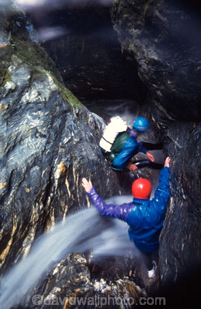 rock;rocks;rocky;climber;climbers;water;rushing-water;canyon;deep;stream;flow;flowing;helmet;helmets;safety-gear;safety-equipment;wet;descent;descend;challenge