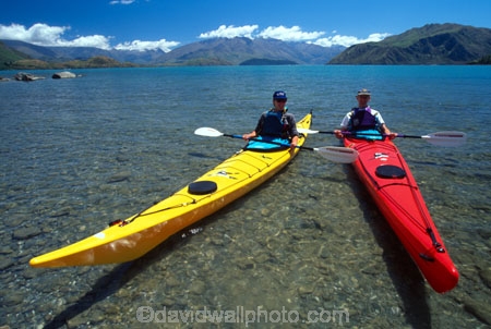 kayak;kayaks;kayaking;kayaker;kayakers;vibrant;colour;holiday;vacation;relax;recreation;recreational;water;lake;paddle;paddling;river;central-otago;shallow-water;riverbed;shadow;shadows;triangle;red-kayak;red-kayaks;yellow-kayak;yellow-kayaks;tip;front;peak;front