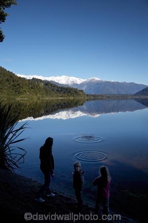 alp;alpine;alps;altitude;calm;child;children;families;Family;high-altitude;lake;Lake-Mapourika;lakes;little-boy;little-girl;main-divide;mother;mothers;mount;mountain;mountain-peak;mountainous;mountains;mountainside;mt;mt.;N.Z.;New-Zealand;NZ;peak;peaks;placid;quiet;range;ranges;reflection;reflections;ripple;ripples;S.I.;serene;SI;Skipping-Stones;smooth;snow;snow-capped;snow_capped;snowcapped;snowy;South-Is.;South-Island;South-West-New-Zealand-World-Heritage-Area;southern-alps;still;summit;summits;Te-Poutini-National-Park;Te-Wahipounamu;tranquil;water;West-Coast;Westland;Westland-National-Park;World-Heritage-Area