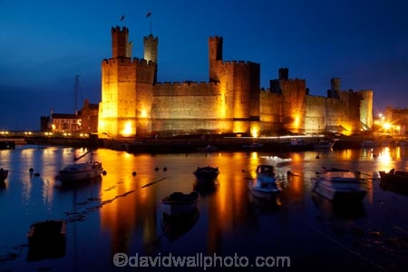 Afon-Seiont;battlement;battlements;boat;boats;Britain;British-Isles;building;buildings;Caernarfon;Caernarfon-Castle;calm;Carnarvon;Carnarvon-Castle;Castell-Caernarfon;castellated;castellations;castle;castles;crenellation;crenellations;Cymru;dark;dusk;Dymar-dre;evening;flood-lighting;flood-lights;flood-lit;flood_lighting;flood_lights;flood_lit;floodlighting;floodlights;floodlit;fort;fortification;fortress;fortresses;G.B.;GB;Great-Britain;Gwynedd;heritage;historic;historic-building;historic-buildings;historical;historical-building;historical-buildings;history;light;lights;medieval-castle;medieval-castles;night;night-time;night_time;old;placid;quiet;reflection;reflections;River-Seiont;serene;smooth;still;stone-buidling;stone-building;stone-buildings;tradition;traditional;tranquil;twilight;U.K.;UK;UN-world-heritage-site;UNESCO-World-Heritage-Site;United-Kingdom;united-nations-world-heritage-site;Wales;water;Welsh-Castle;Welsh-Castles;Welsh-Flag;Welsh-flags;world-heritage;World-Heritage-Park;World-Heritage-site;World-Heritage-Sites