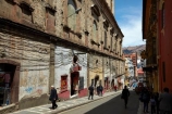 alley;alleys;alleyway;alleyways;Bolivia;Bolivian;building;buildings;capital;Capital-of-Bolivia;Cathedral-Basilica-of-Our-Lady-of-Peace;Chuqi-Yapu;cities;city;heritage;historic;historic-building;historic-buildings;historical;historical-building;historical-buildings;history;Hostel-Torino;Hotel-Torino;La-Paz;La-Paz-Basilica;La-Paz-Cathedral;Latin-America;Narrow-street;narrow-streets;Nuestra-Señora-de-La-Paz;old;people;person;power-lines;power-wires;Socabaya;South-America;steep-street;steep-streets;Sth-America;street;streets;The-Americas;tradition;traditional;wired;wires
