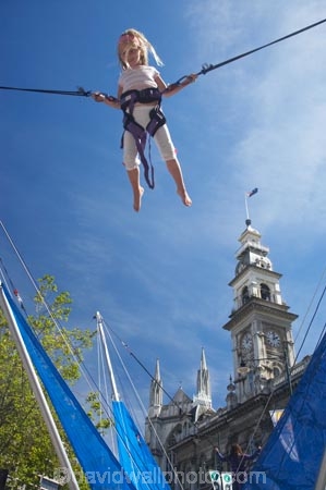 amusement-park;amusement-parks;bungy-trampoline;carnival;carnivals;child;children;Dunedin;Dunedin-Festival;fair;fairground;fairgrounds;fairs;fun-fair;fun-fairs;fun-park;fun-parks;funfair;funfairs;girl;girls;kid;kids;little-girl;little-girls;Municipal-Chambers-Clock-Tower;N.Z.;New-Zealand;NZ;Octagon;Otago;S.I.;SI;Small-Child;South-Is.;South-Island;trampoline