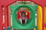 girls;girl;little;child;children;play;playing;playground;play_ground;play-ground;playgrounds;play_grounds;play-grounds;outdoor;outdoors;outside;playtime;fun;moving;movement;childhood;happiness;happy;joy;kid;kids;daughter;tunnel;equipment;play-equipment;jungle-gym;primary-colours;colors;color;colour;red;green